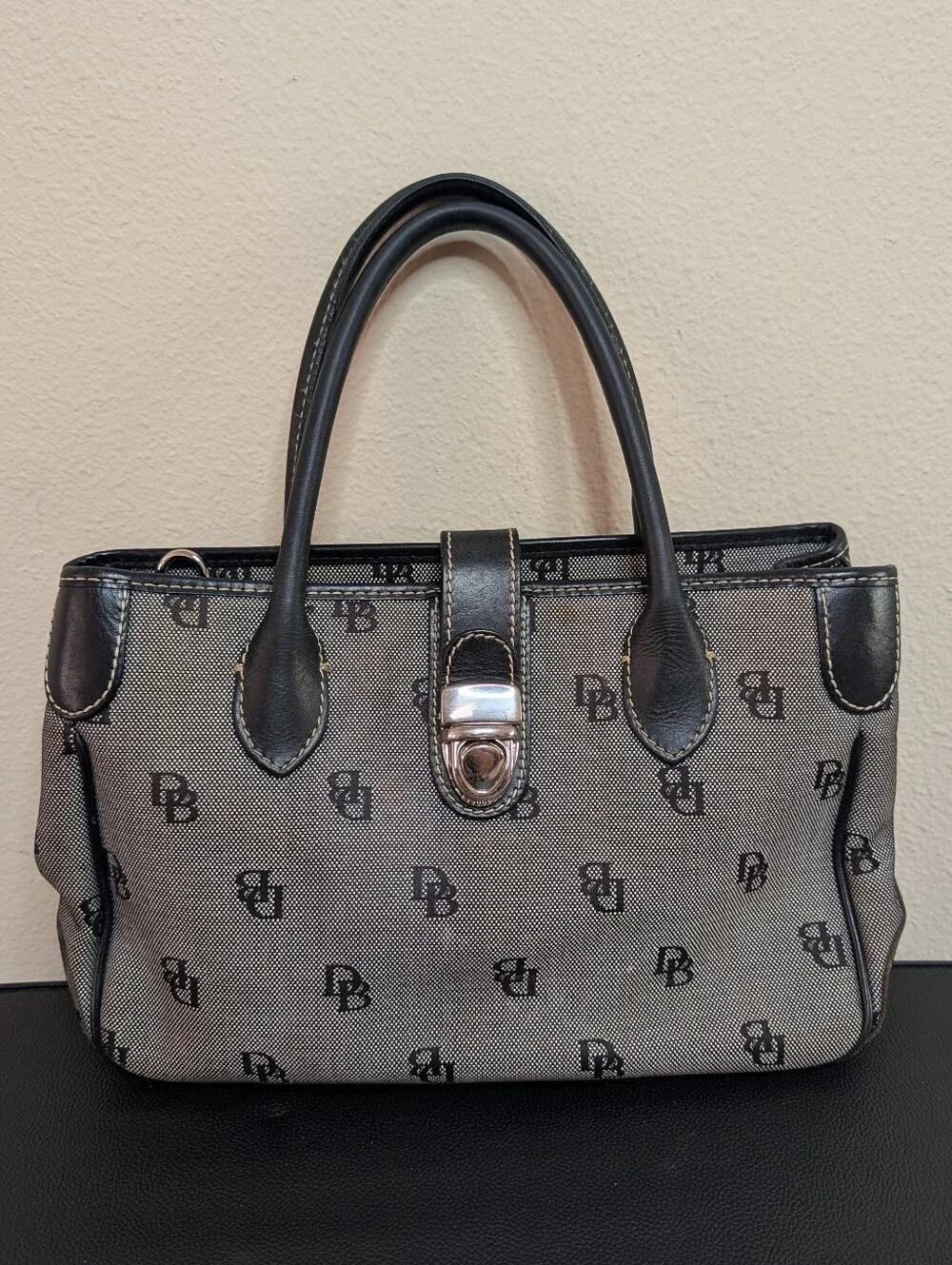 Dooney and Bourke Vintage DB Signature Tote Black Grey Push Lock Handbag